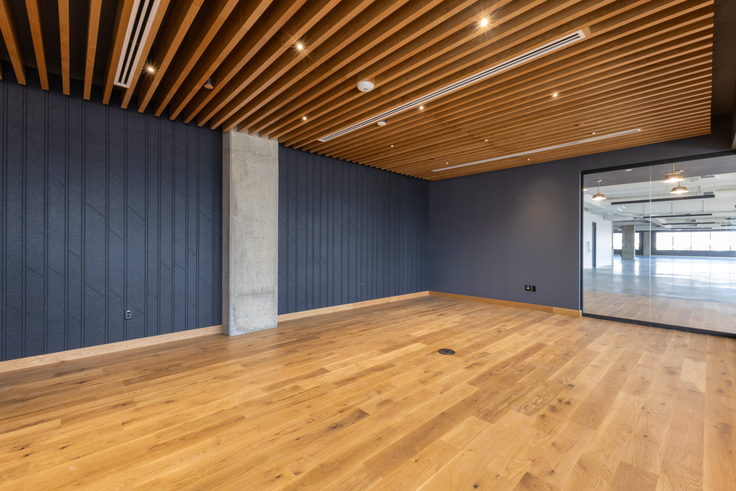Wood slat and acoustical ceiling installation on a completed BSI project